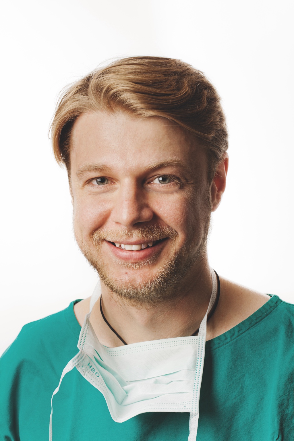 Dr. Georg Pfeiler im Arztkittel